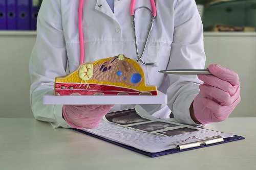 A lab technician performs tests to detect a pancreatic tumor.