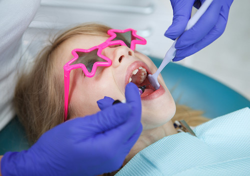 Why is it better to make an appointment with a pediatric dentist at K+31?