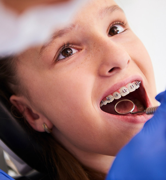 Who is a pediatric orthodontist and what do they do?
