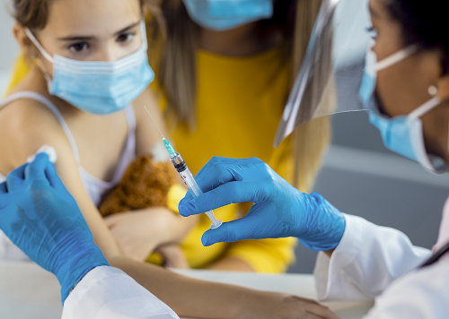 A girl undergoes a skin allergy test with a pediatric allergist at a modern medical clinic.
