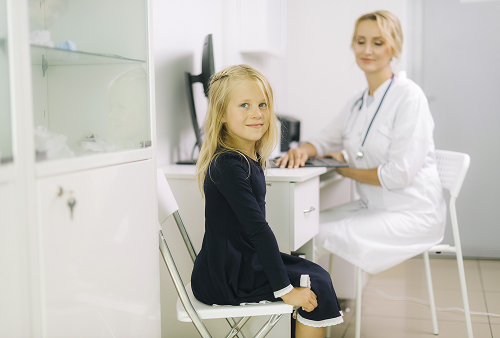 A pediatric gynecologist sees a teenage girl in a cozy office at a Moscow clinic.