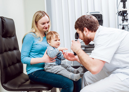 A young mother and her child at a consultation with a private pediatric ENT doctor