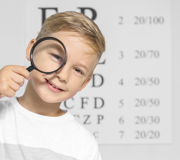 An ophthalmologist checks a child's vision at a children's clinic in Moscow.