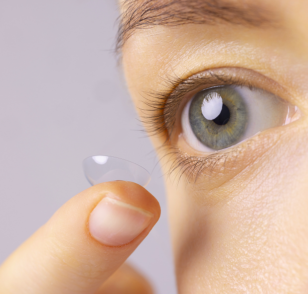 A pediatric ophthalmologist conducts a consultation with a small patient.