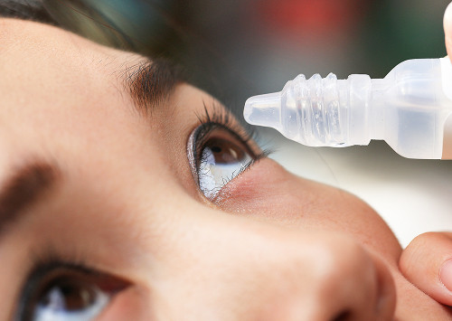 How is an optical examination of the posterior segment of the eye performed?