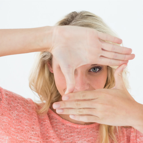 What is a scotoma and how does it differ from a physiological blind spot?