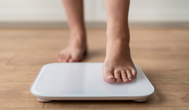 Man stands on scales